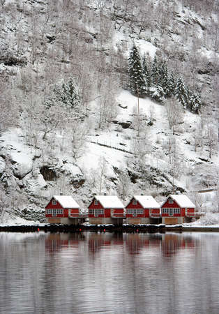 Four red houses in the fjordの写真素材