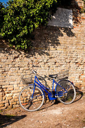 Blue bike on a wallの写真素材