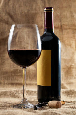 Red wine glass and bottle の写真素材
