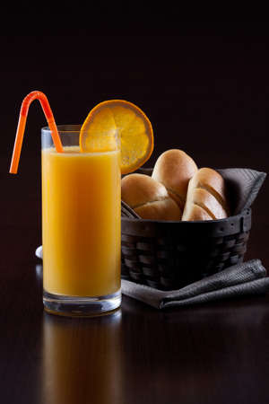 Orange juice breakfast with sweet breadの写真素材