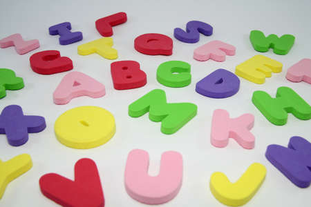 Colorful letters alphabet made of foam isolated on white background の写真素材