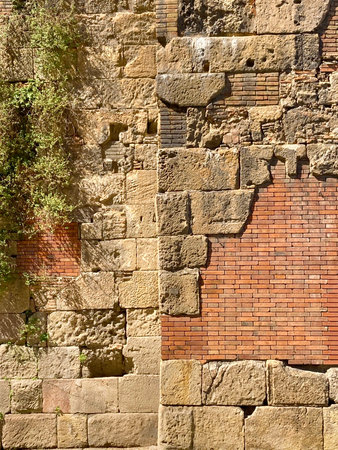 Close image of various materials on a wall. Ancient wall, traditional architecture, palimsestの写真素材