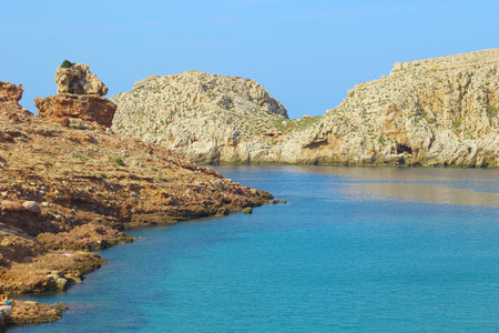 Image of the rocky coast. Blue water and rocks.の写真素材
