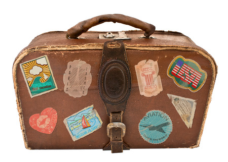 Travel Suitcase with stickers  Vintage suitcases  Isolated on white backgroundの写真素材
