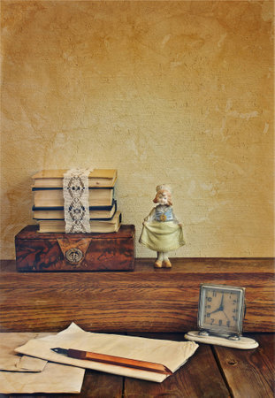 Vintage composition with books and porcelain doll.