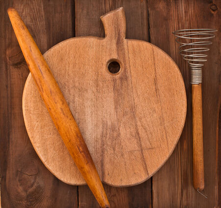 Skalka, cutting board and whisk on an old wooden tableの写真素材