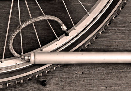 pumping bicycle wheel bicycle pump. toning effectの写真素材