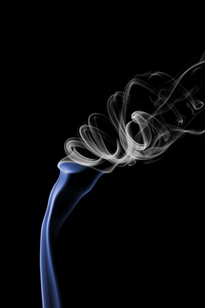 Closeup shots of smoke rising off incense.の写真素材