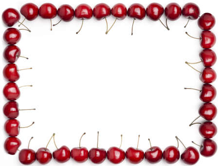 A border made of cherries isolated on a white background.の写真素材