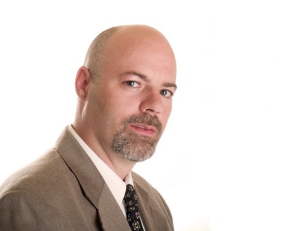 Stock photo of a well dressed confident businessman looking directly at the camera, isolated on white.の写真素材