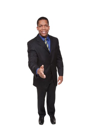 Isolated studio shot of a businessman reaching out to shake hands.の写真素材