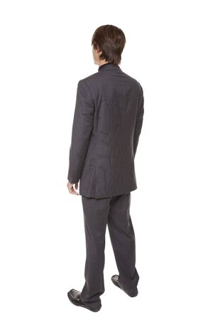 Isolated full length studio shot series of a businessman rotating through 360 degrees.の写真素材