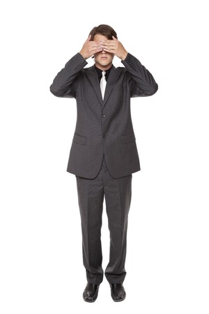 Isolated studio shot of a businessman in the See No Evil pose.の写真素材