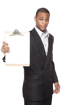 Isolated studio shot of an African American businessman presenting a blank clipboard to the camera.の写真素材