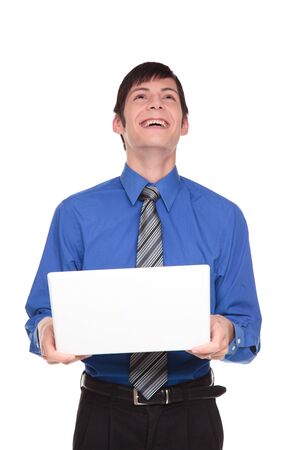Isolated studio shot of a Caucasian businessman tilting his head back and laughing at what he sees on his computer.の写真素材