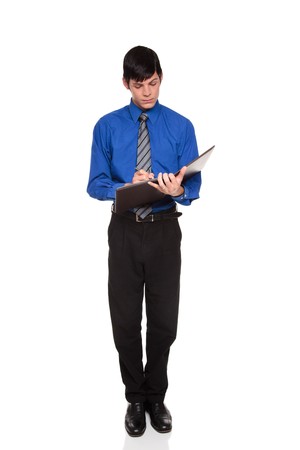 Isolated studio shot of a Caucasian businessman taking down notes on a nice notepad while standing.の写真素材