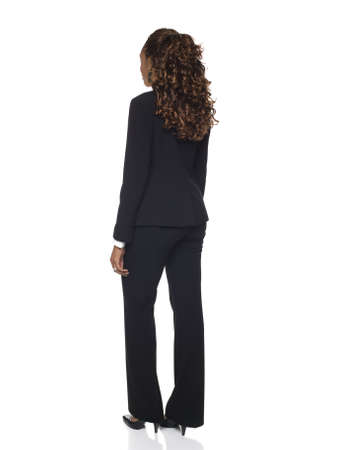 Isolated studio shot of a businesswoman rotating through 360 degrees.の写真素材