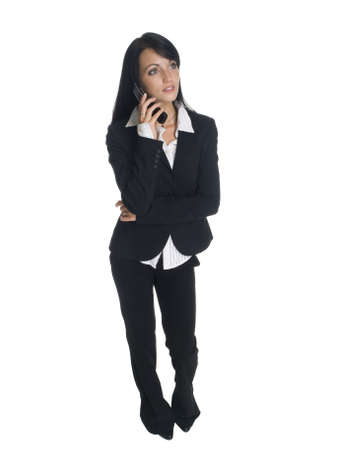 Isolated studio shot of a businesswoman talking on her cell phone.の写真素材