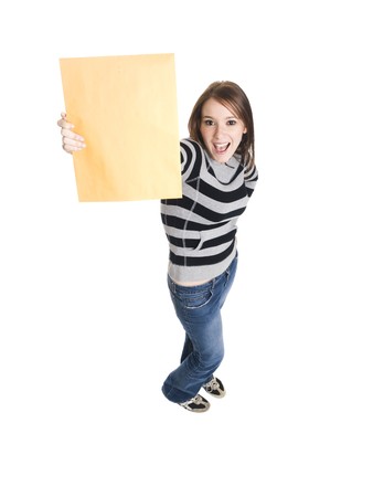 Isolate studio shot of a casually dressed young adult woman grinning as she holds up a manilla envelope.の写真素材