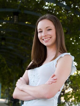 Stock photo of a woman casually dressed in a blue shirt and blue jeans.の写真素材