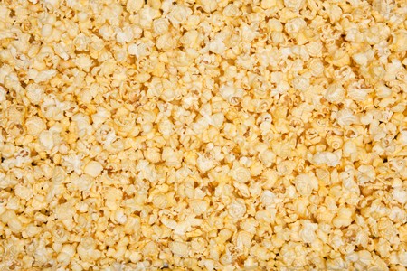 Yellow movie style popcorn backgroundの写真素材