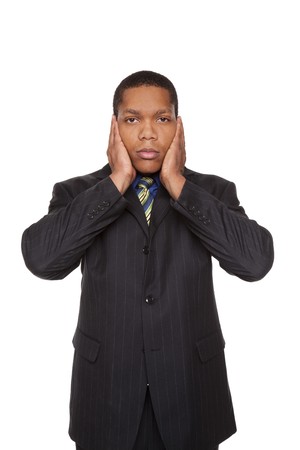 Isolated studio shot of a businessman in the Hear No Evil pose.の写真素材