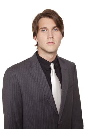 Isolated closeup studio shot of a businessman looking at the camera.の写真素材