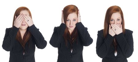 Isolated studio shot of a businesswoman in the See No Evil, Hear No Evil, Speak No Evil pose.
