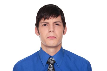 Isolated studio shot of a Caucasian businessman making a displeased or angry expression.の写真素材