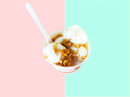 Ice cream in a cup with pastel background.