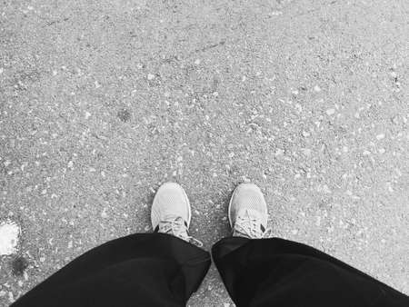 Shoes and walkers of people are exercising in the park.Black and white tone.の写真素材
