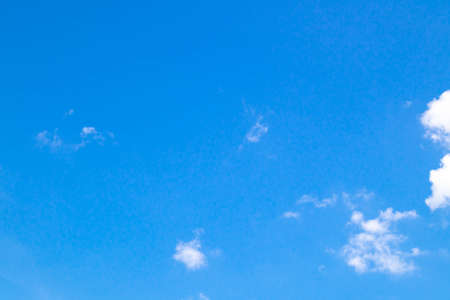 Blue sky background with clear clouds.の写真素材