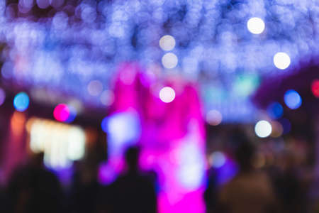 Abstract night bokeh and blurred people background in new year festival at Jungceylon, Phuket, Thailand.の写真素材