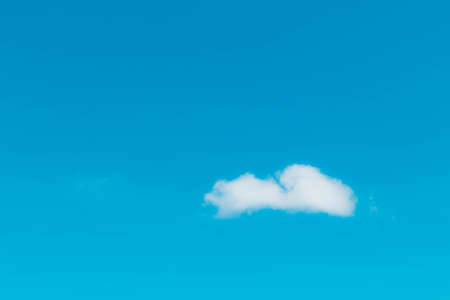 White clouds in the blue sky.