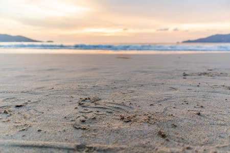 Stone on the beautiful sandy beach with a peaceful and relaxing summer holiday.の写真素材