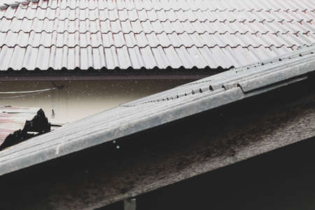 Roof of house on a rainy day during the rainy season