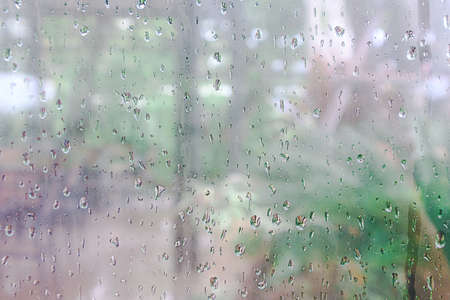 Water droplets perched on the glass after the rain.Background, wallpaper and texture.