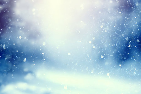 Winter background with falling white snow and soft bokeh lights on blue sky. Cold nature scene for Christmas during cold weather time.の素材
