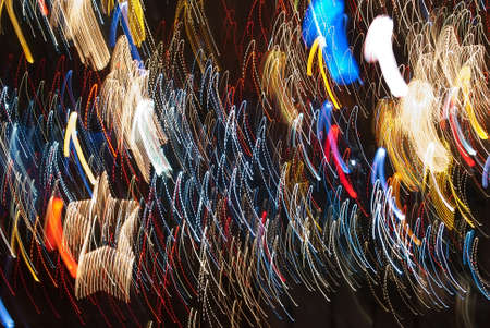 abstract glowing background resembling motion blurred neon light curves