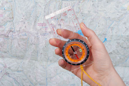 compas, map and hand