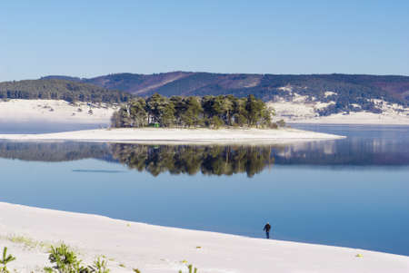 island in winter lakeの写真素材