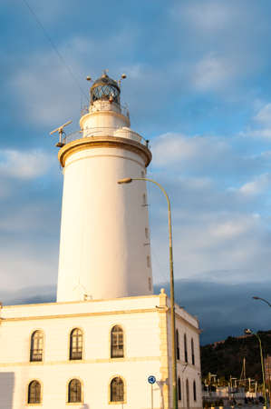 Lighthouse in Malaga in Andalusia, Spain at sunsetの写真素材