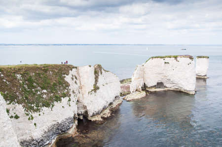 The Old Harry Rocks are three chalk formations including a stack and a stump located on the Isle of Purbeck in Dorsetの写真素材