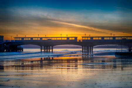 Bournemouth Sea Front Pier.The rain is pelting down on the Bournemouth pier. The pier juts out over the English Channel and is only for one to promenade along to get a good vantage point over the seaの写真素材