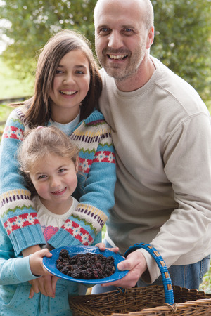Father posing with his daughtersの写真素材