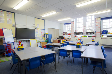 A horizontal image of an empty primary school classroom. The setting is typically British.の写真素材