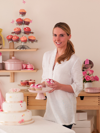 Woman baking cakes at homeの写真素材