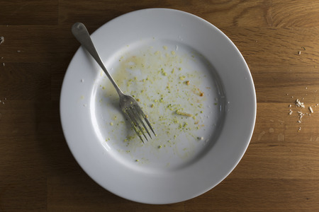 Ariel view of a plate after a meal has been clearly enjoyed and finished.の写真素材