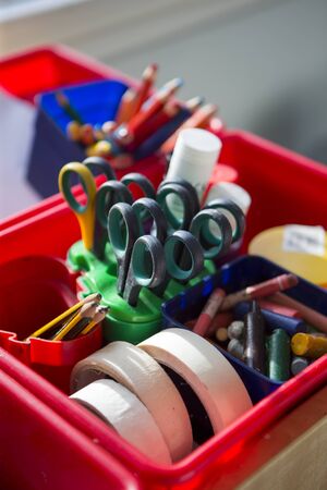 Close up of school equipment in a pot on a table.の写真素材