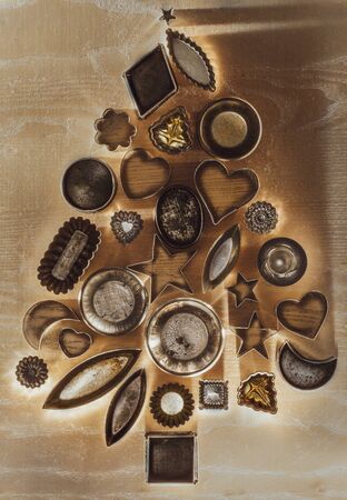 Christmas tree shape made from cookie cutters and food accessories. の写真素材